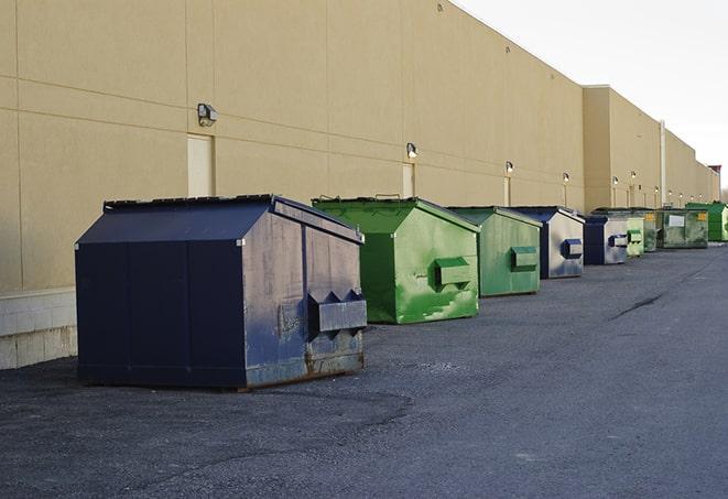 a row of construction dumpsters parked on a jobsite in Coppell